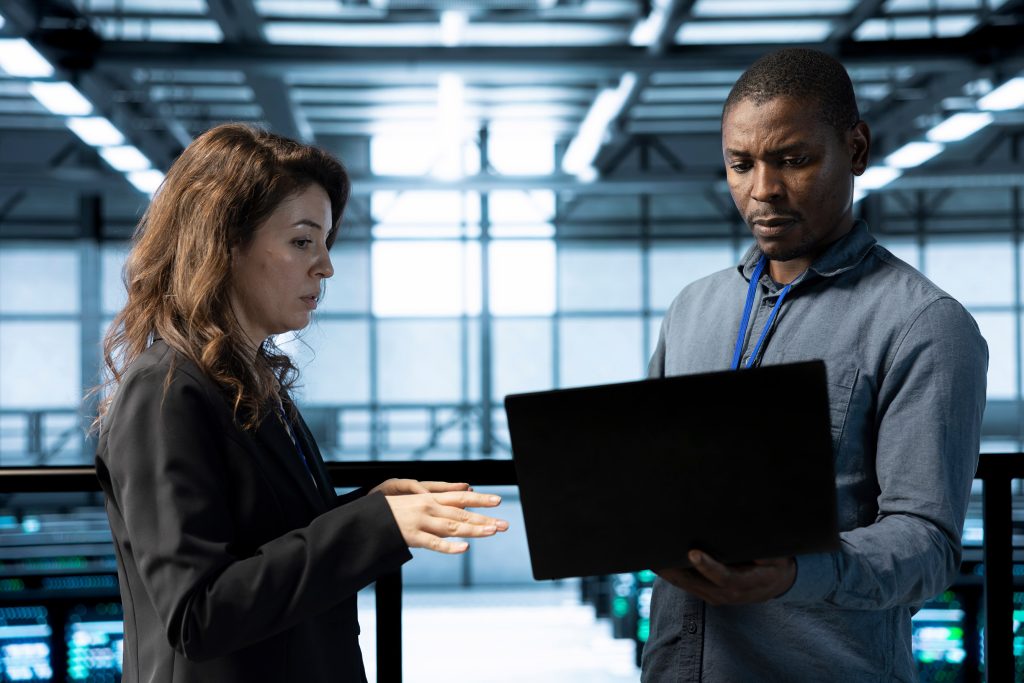 colleague using laptop to review data